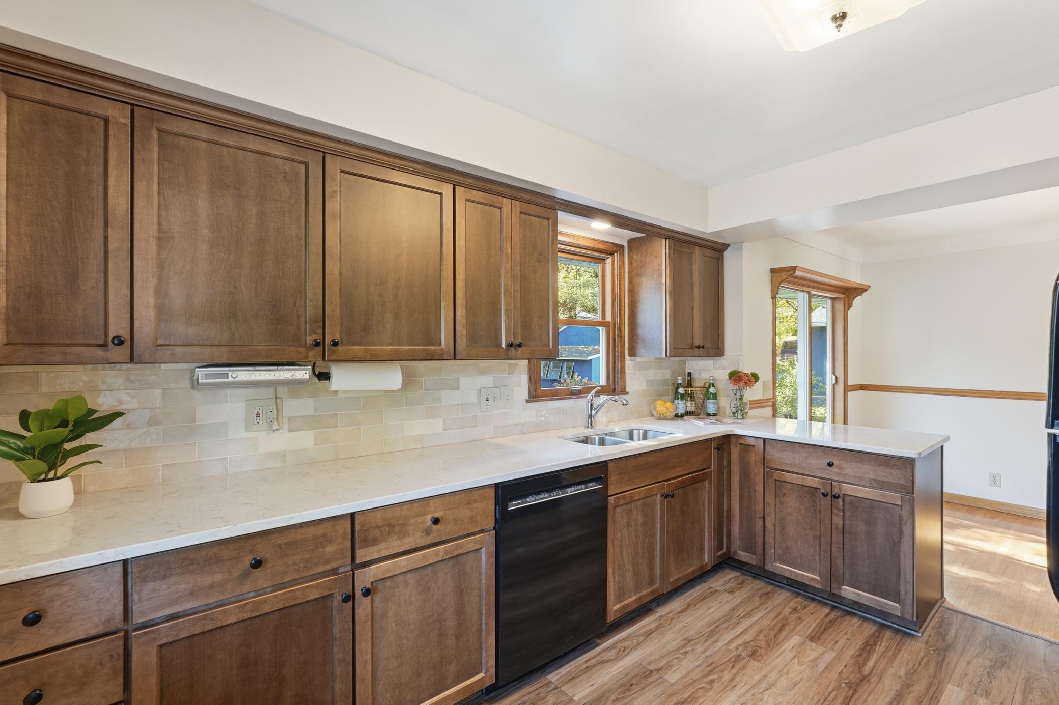 Lovely maple cabinets and newer flooring.