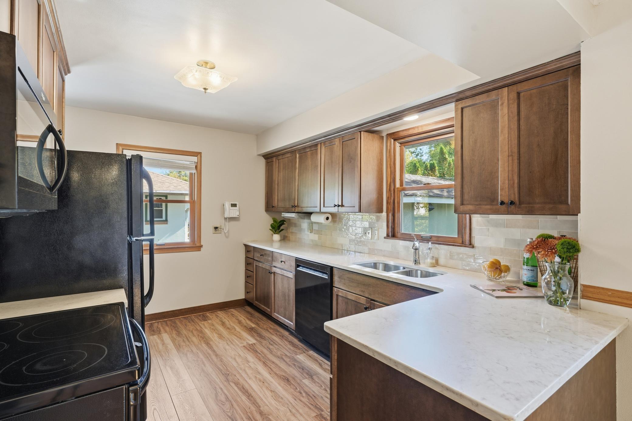 Updated kitchen with wonderful storage and counter space and great views of the yard.