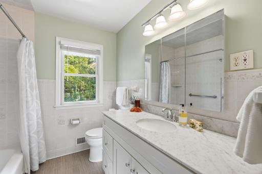 Main level full bath with views of the private yard.