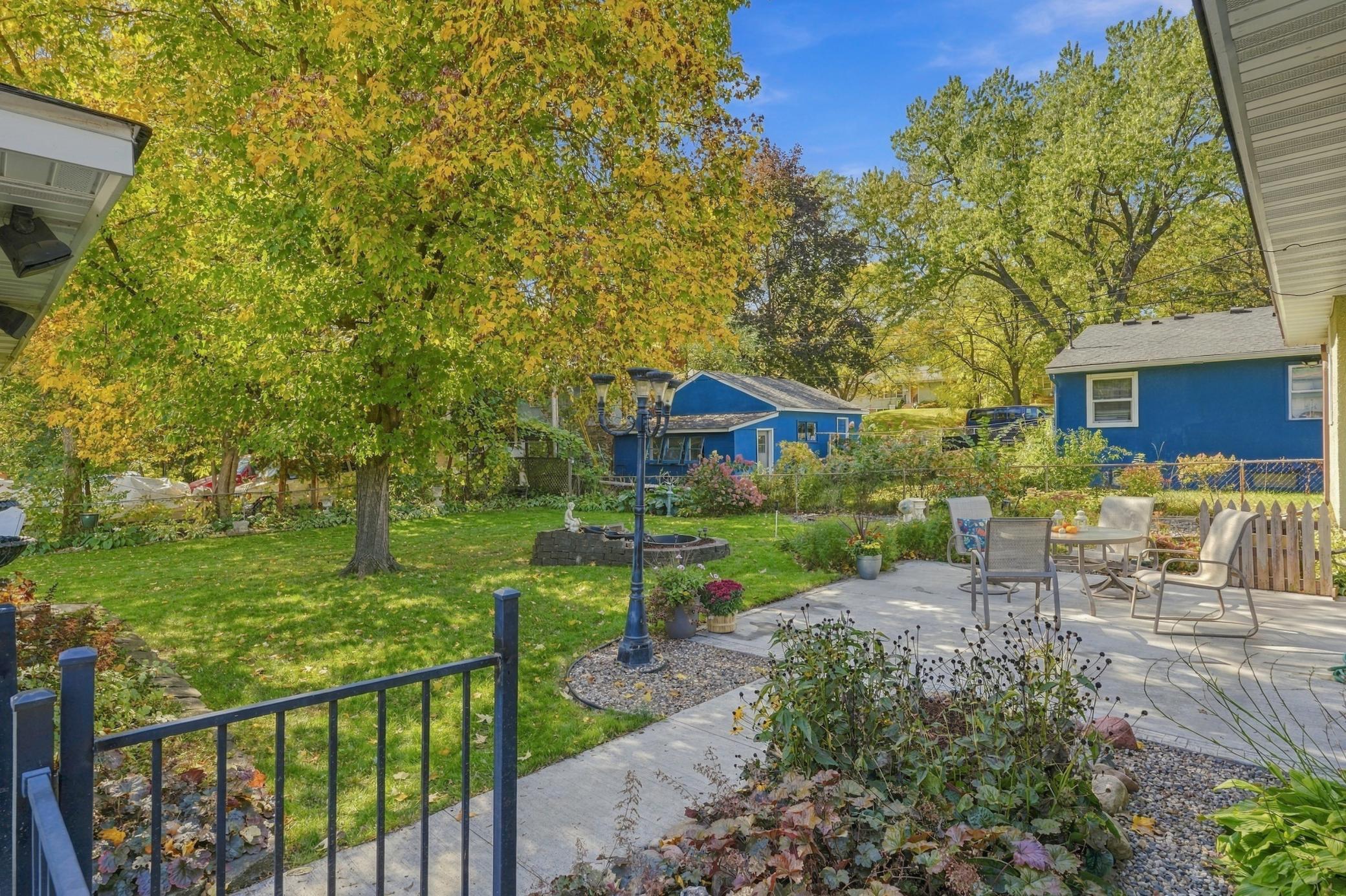 Glorious backyard with a 15x16 patio area and colorful perennial gardens throughout.
