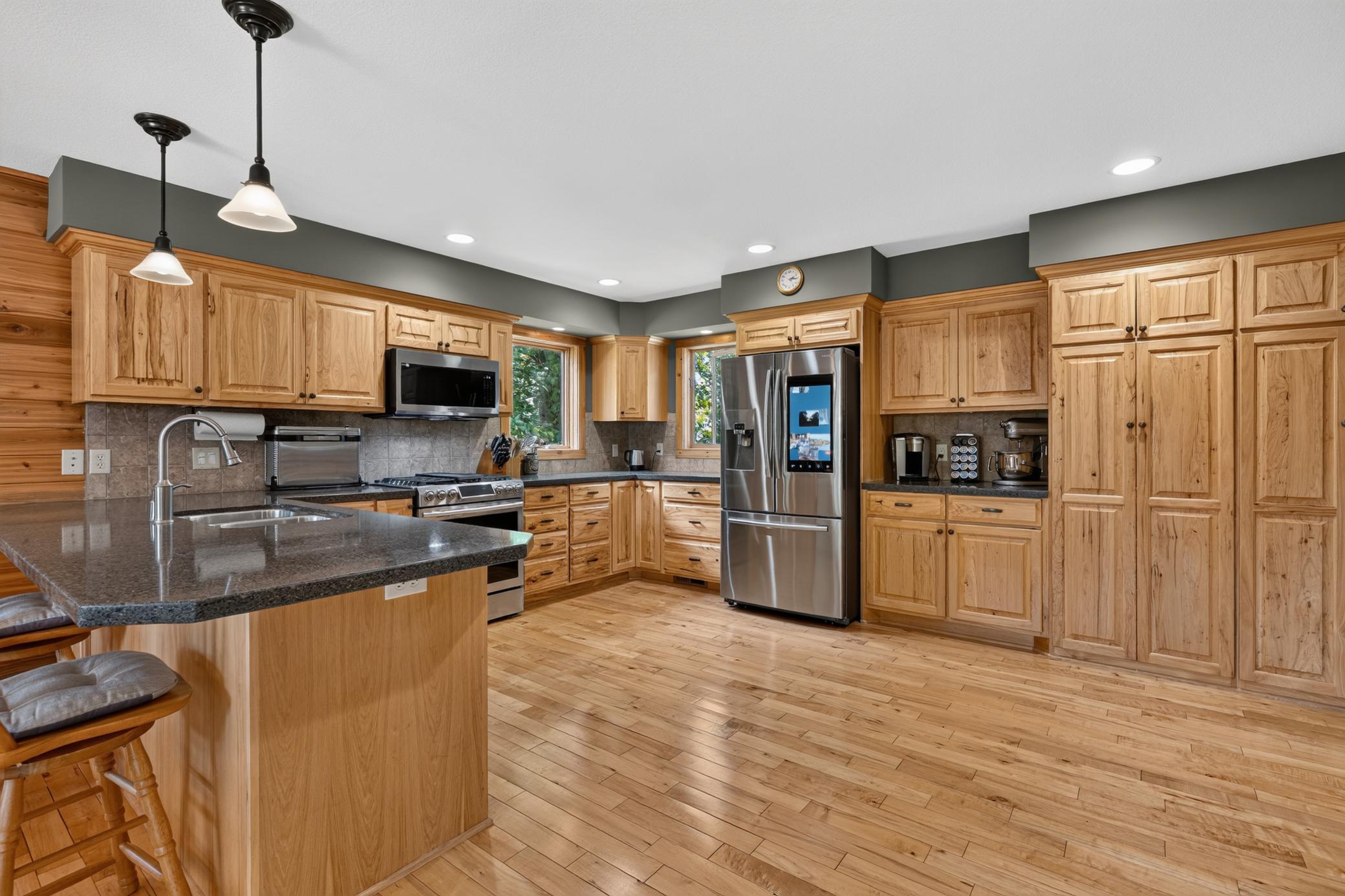 Well equipped kitchen with two refrigerator and almost new appliances.d