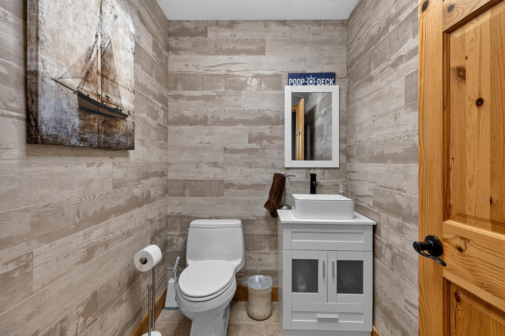 1/2 bath between the kitchen and the foyer.