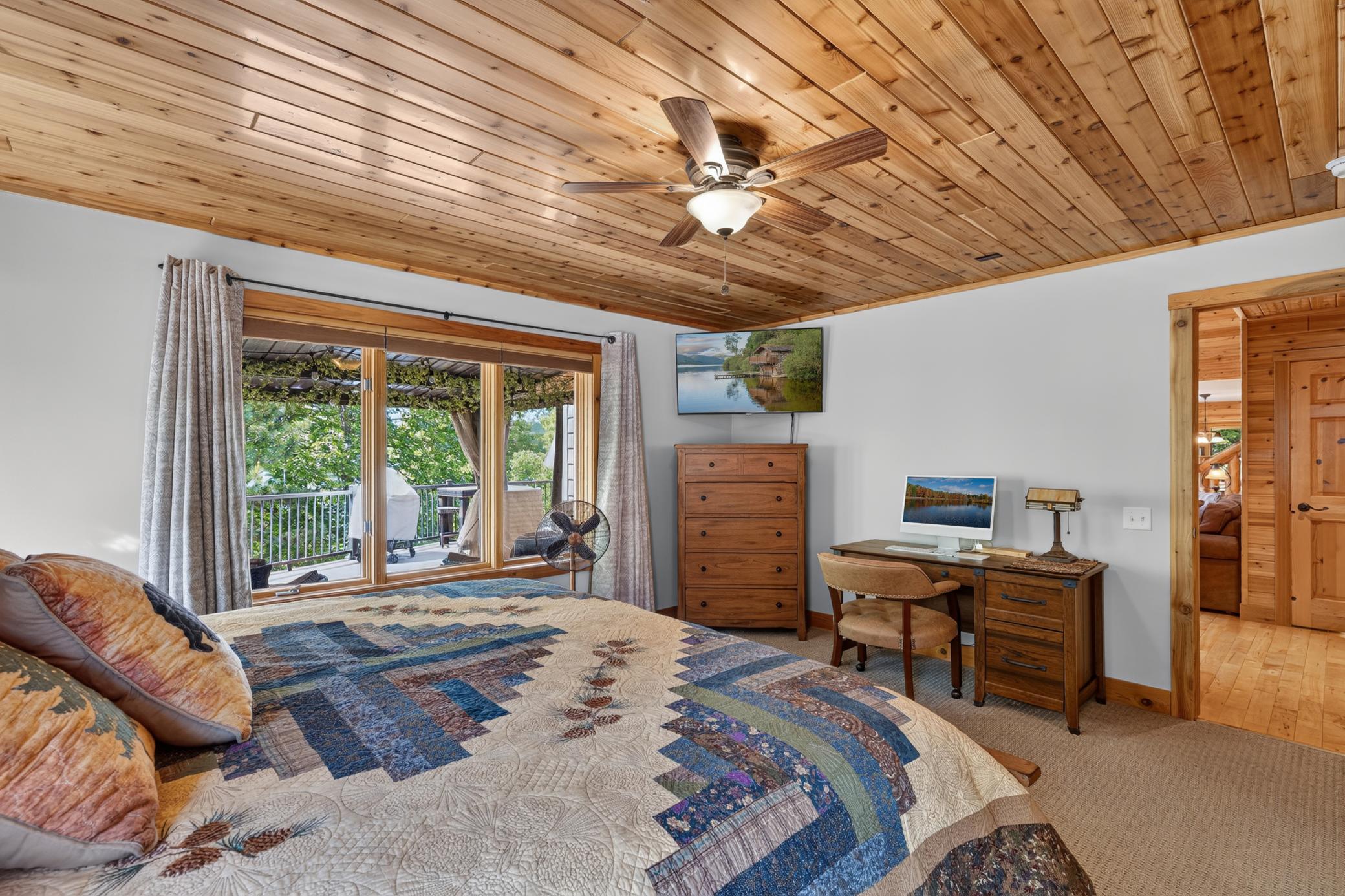 Primary bedroom with views of the lake.
