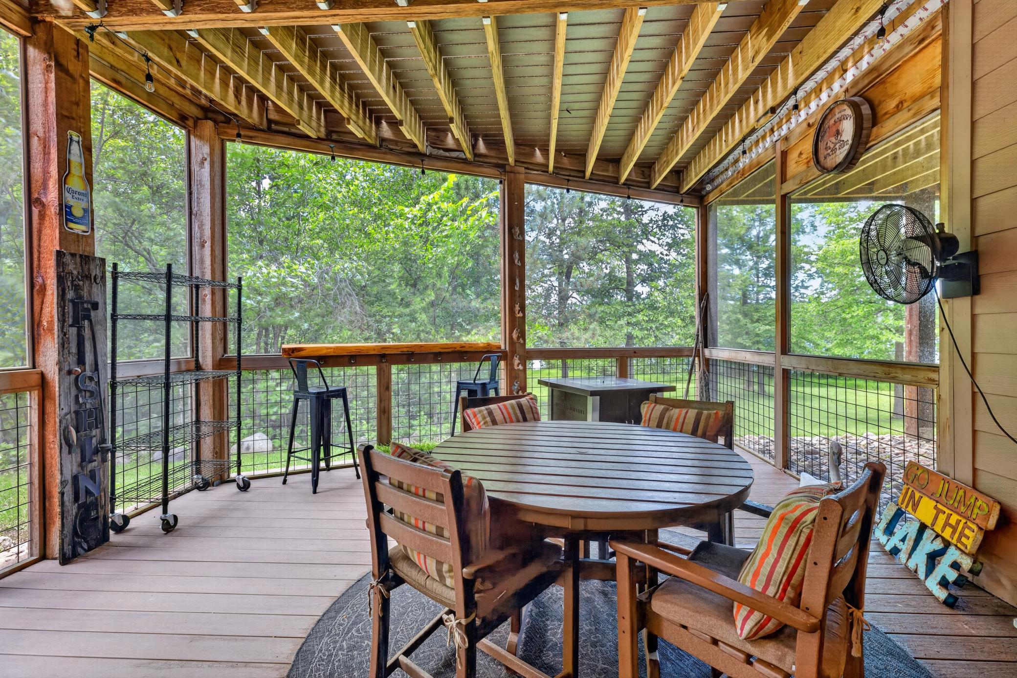 Cool and airy lower level screen patio under the deck.