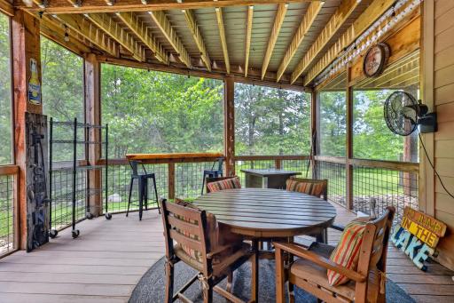 Cool and airy lower level screen patio under the deck.
