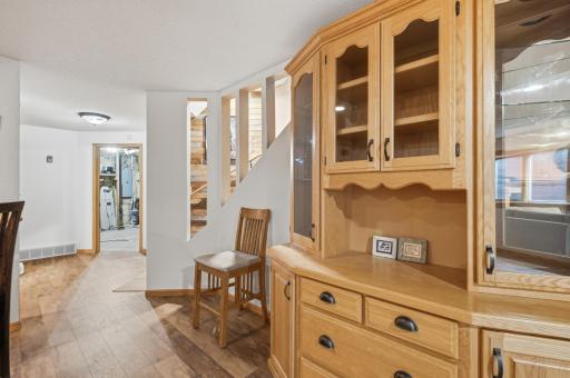 This solid oak cabinet adds to the ample storage, it is not built in but will stay with the home.