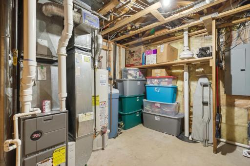 Utility room showing the high efficiency furnace, gas water heater, water softener and radon mitigation system.