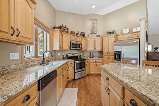 Gorgeous kitchen with granite counter tops and stainless steel appliances.