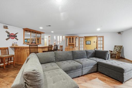 The lower level family room includes a wet bar for entertaining.