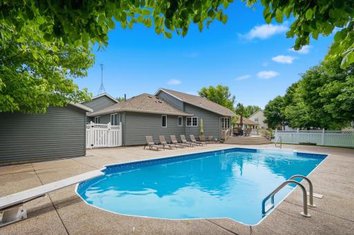 You will love this private back yard pool surrounded by exposed aggregate.