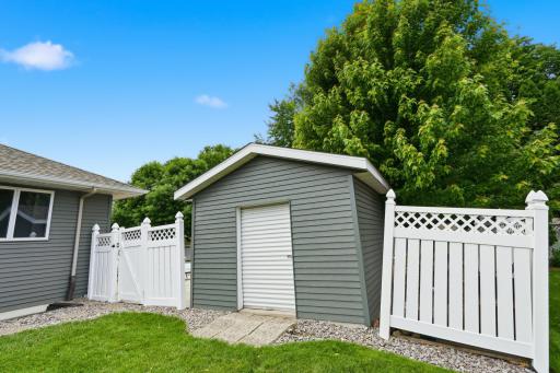 12 x 10 storage shed has electricity and handy roll up door.