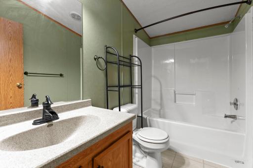 The 2nd bathroom is located near the two additional bedrooms and boasts a full tub and shower.