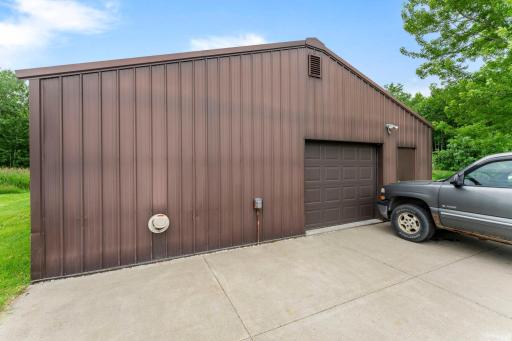 The large pole barn has a concrete parking pad for extra parking.