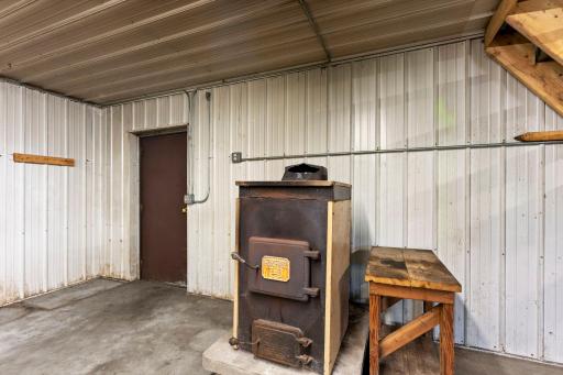 The pole barn includes a wood burning stove.