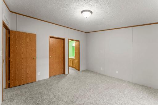 Your new primary bedroom has a large walk-in closet and easy access to a spacious ensuite bathroom.