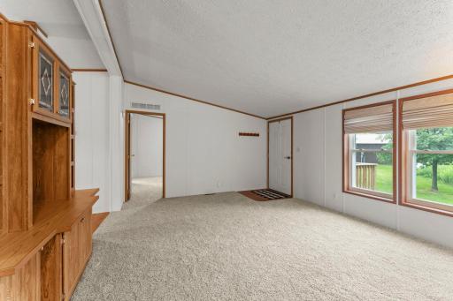 Enter into your new living room and enjoy the light that shines throughout.