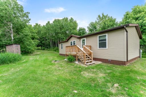 The woods surrounding the home are serene.