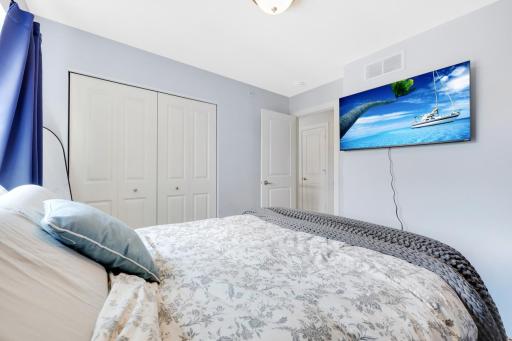 The 2nd bedroom has a great shelving system in the closet.
