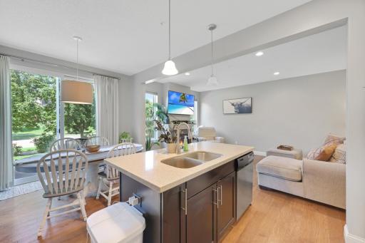 The granite counter and undermount sink on the center island really stand out [*again... please ignore the aforementioned garbage can and cords. My bad].