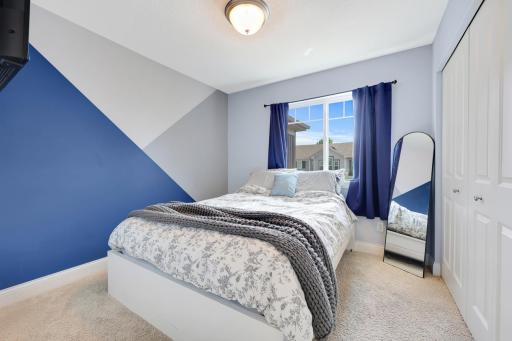 The 2nd bedroom has a great shelving system in the closet.