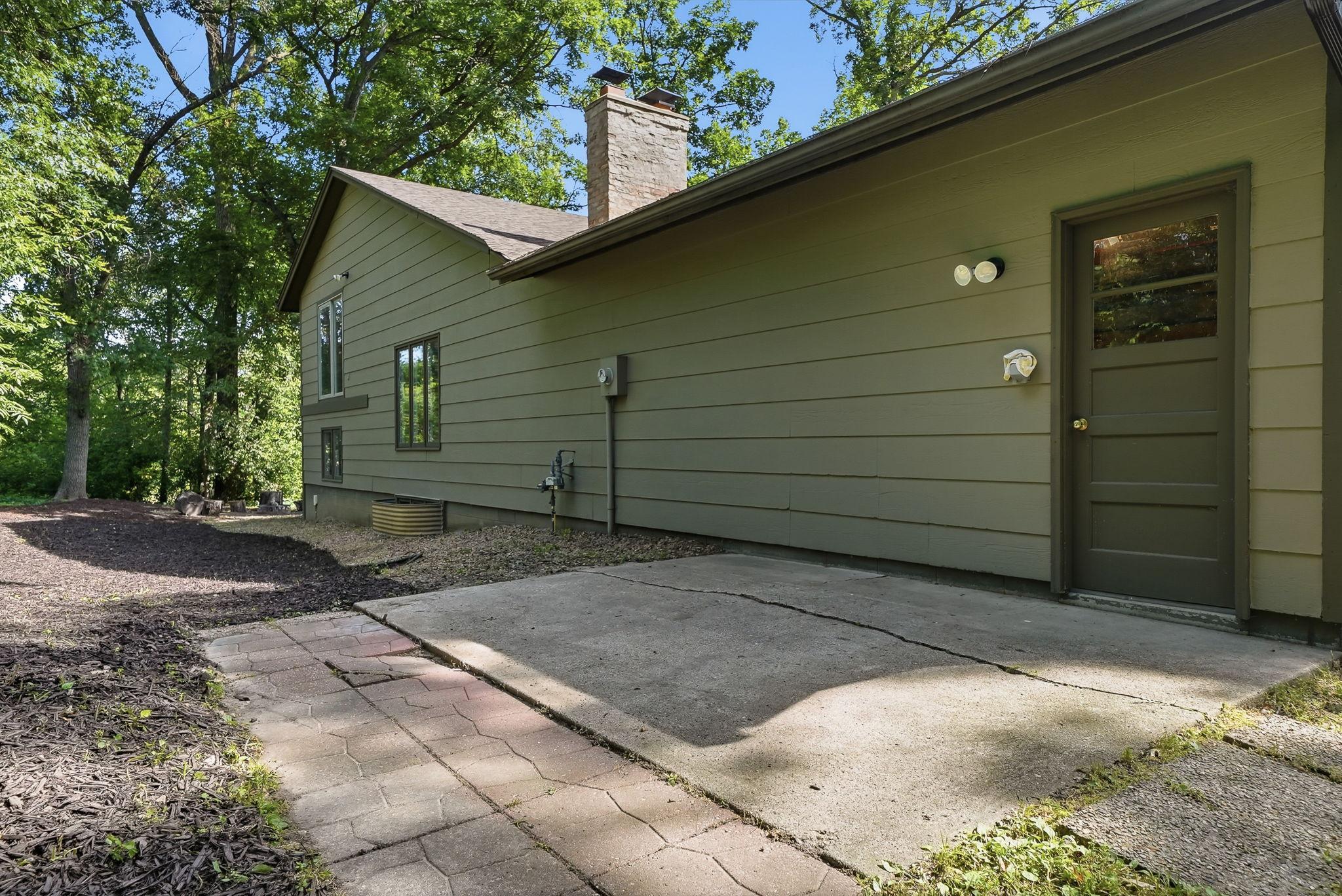 The garage features a door leading to the back yard.