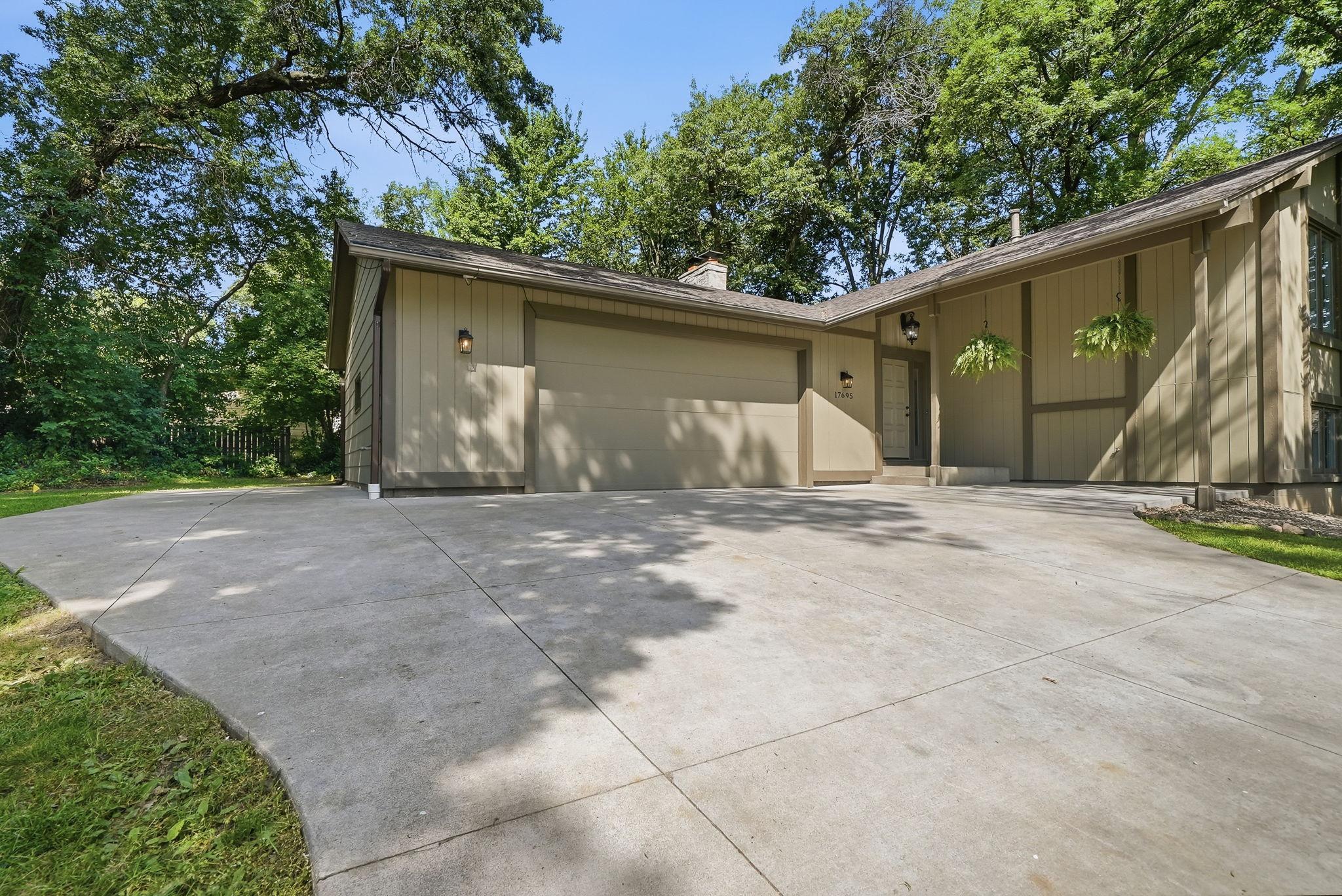 The concrete driveway includes an extra parking pad for your boat or camper.