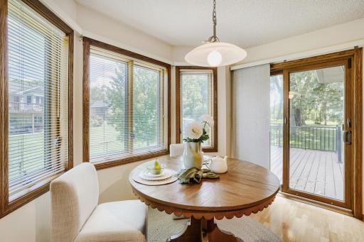 A sliding glass door provides easy access to the maintenance-free deck, making outdoor grilling
