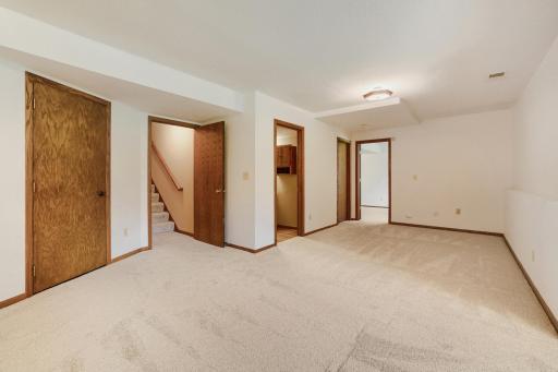 Conveniently located just off the family room is a 3/4 bathroom and a spacious fourth bedroom, creating the ideal setup for overnight guests, multi-generational living, or a private retreat for teenagers