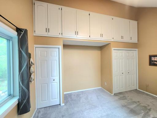 2 closet spaces plus great additional storage in cabinets above.