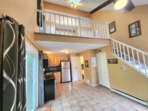 Stunning open bedroom loft with vaulted ceilings above.