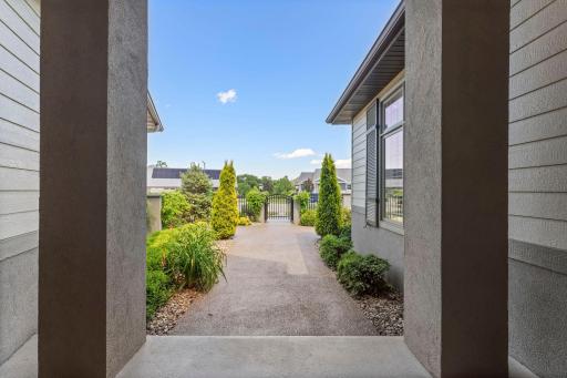 Step into a lush courtyard where every shrub, flower, and tree has been thoughtfully selected by a professional landscaper for seasonal beauty, balance, and lasting visual appeal and all maintenance free.