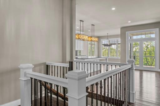This open layout is filled with natural light and an abundance of windows, framing the surrounding views and enhancing the homeâs airy feel.