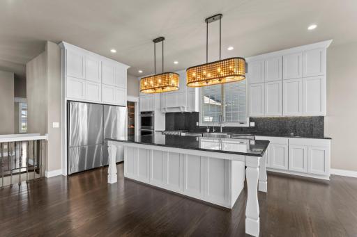 The kitchen is equipped with premium KitchenAid stainless appliances, offering a perfect blend of performance, style, and reliability for everyday cooking and entertaining.