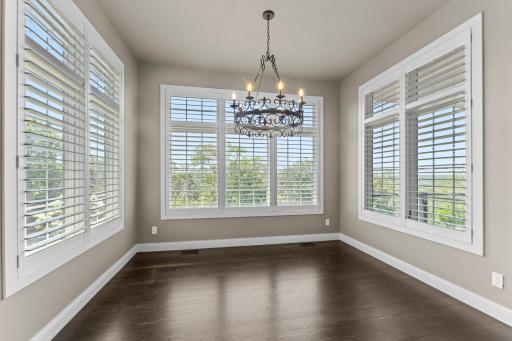 Dining with a view, offering a bright and inviting space to enjoy meals surrounded by natural light and scenic outlooks.