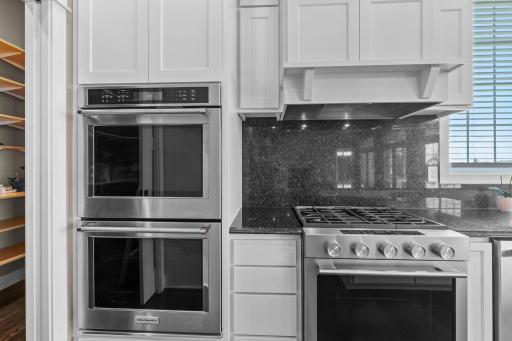 Equipped with double ovens and a commercial-grade exhaust fan, the kitchen is designed to meet the needs of even the most experienced chefs.