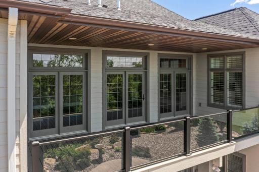 Upper-level deck showcasing transomed windows