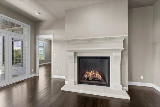 Old World Solid stone fireplace standing 70â high and 83â wide with a large 46â x 42â zoned Heat & Glo gas fireplace insert