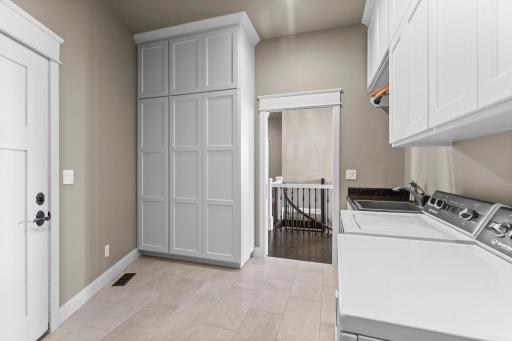 Main floor laundry room/mud room. Extra storage space. Tiled floors
