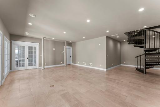 The consistent paint palette carries effortlessly from one floor to the next, creating a smooth, unified flow throughout the home.