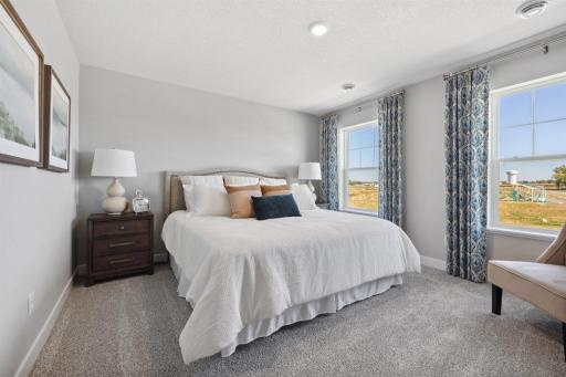 Spacious Primary Bedroom on the upper level. Photo of model home, colors and finishes will vary.