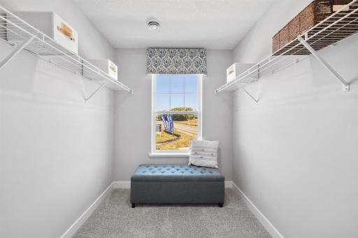 1 of 2 Primary bedroom walk-in closets. Photo of model home, colors and finishes will vary.