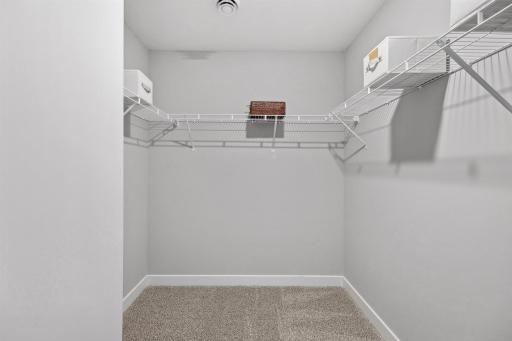 The second walk-in closet in the primary bedroom. Photo of model home, colors and finishes will vary.