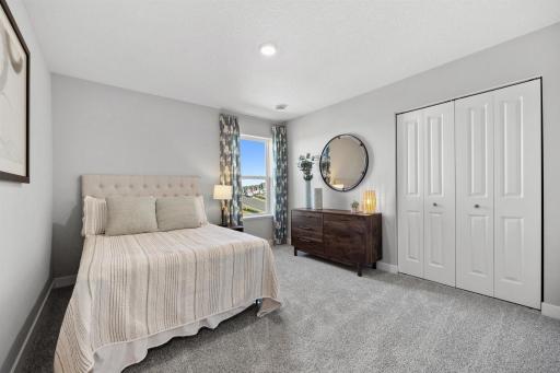 Secondary Bedroom. Photo of model home, colors and finishes will vary.