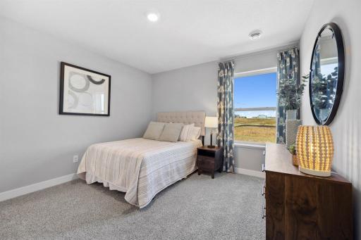 Secondary Bedroom. Photo of model home, colors and finishes will vary.