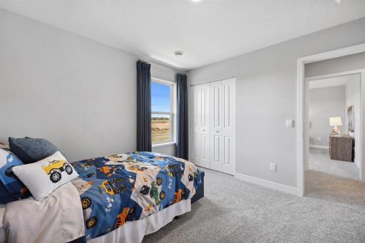 Third Bedroom. Photo of model home, colors and finishes will vary.