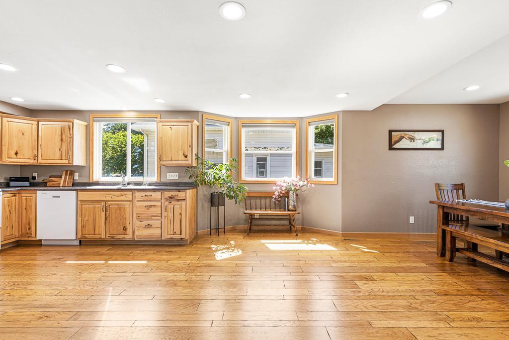 The kitchen / dining area offers so much BONUS space for a movable island, kitchen expansion, or a LARGE family-sized table!