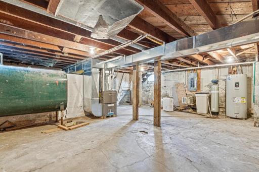The basement is wonderful storage space and houses the mechanicals! The fuel oil tank in the left of the picture is NOT in use. The property is serviced by natural gas,