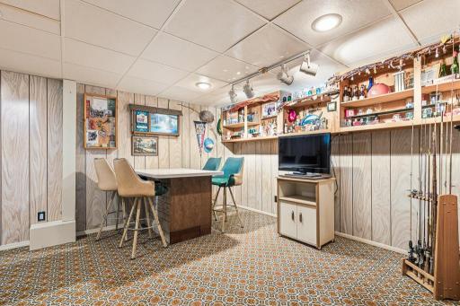 Great bonus space in lower level! Currently set up as a bar/hang out space.