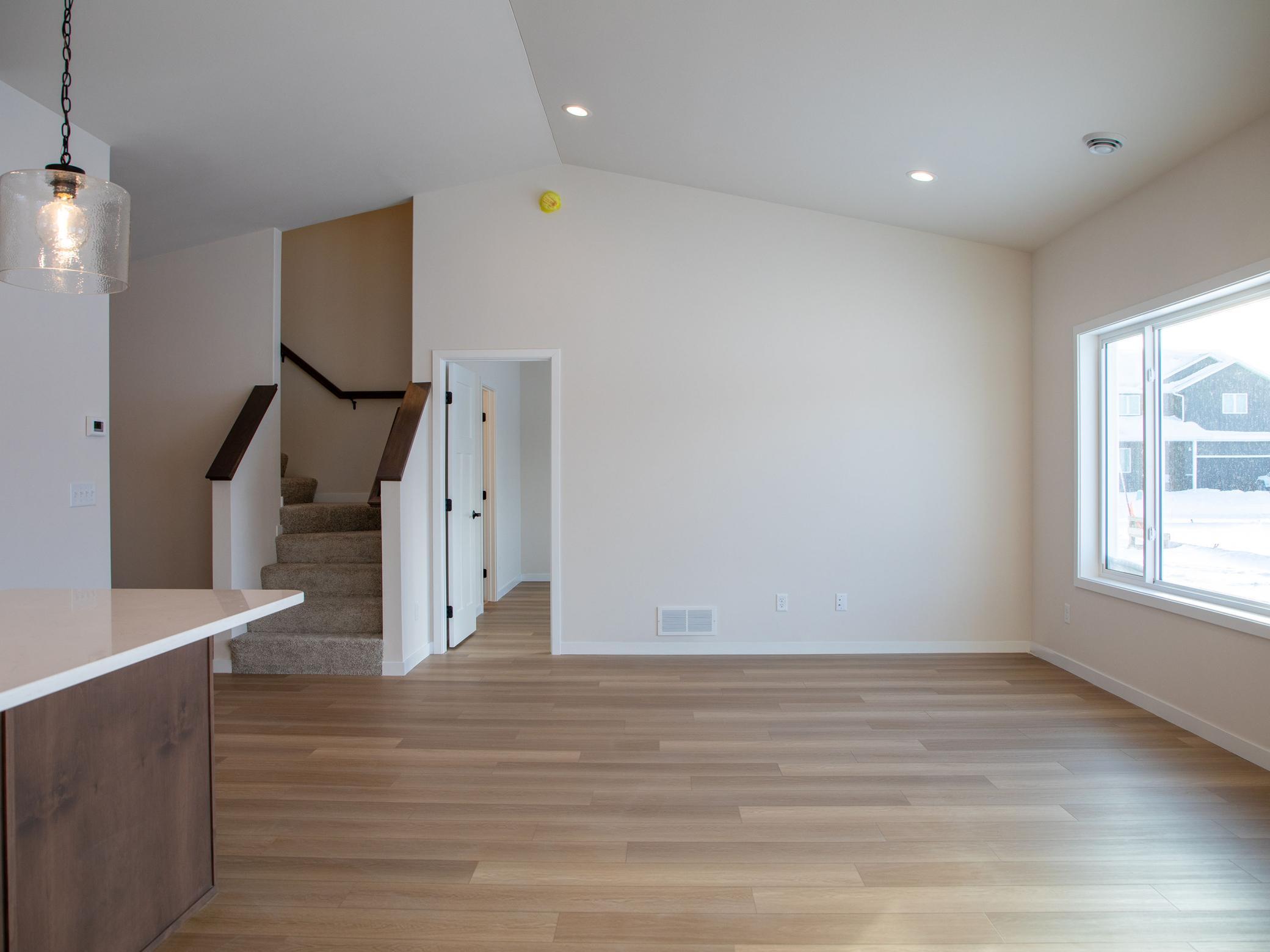 Living Room with view to Primary Suite and Bonus Room