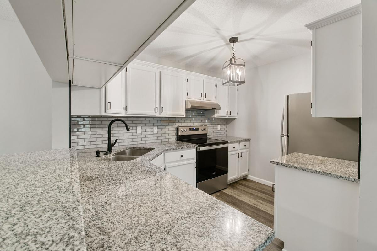 Granit counter tops, white enamel cabinets, stainless steel appliances, waterproof High Luxury vinal floors.
